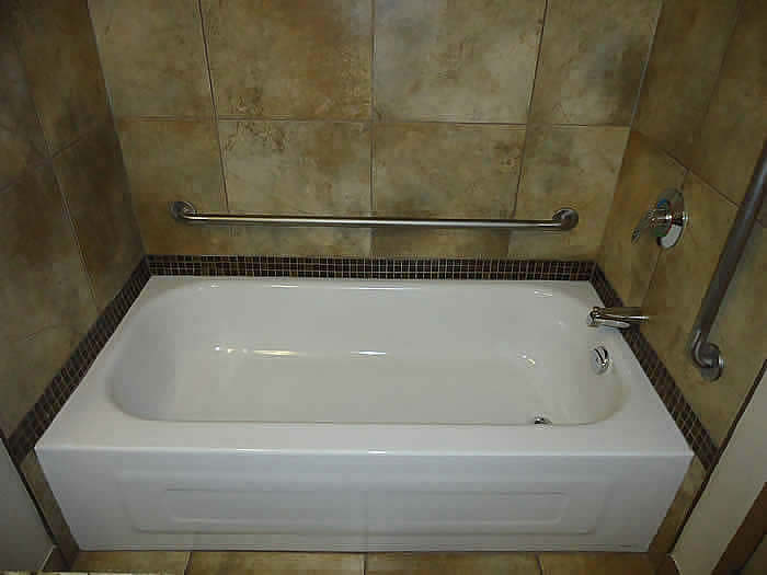 a bathtub refinished and support rails installed