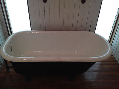 An antique cast iron bathtub just refinished